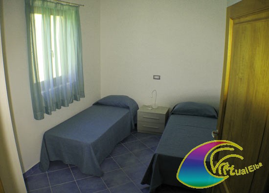 Camera con due letti appartamento piano terra